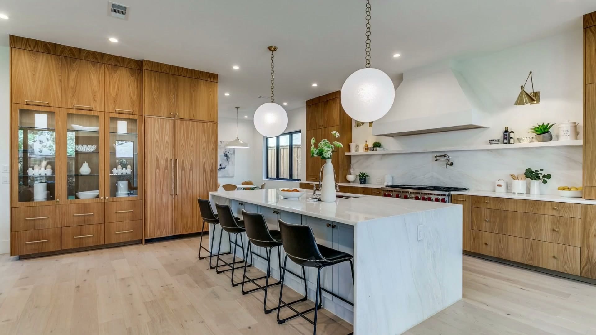A real Patten Custom Homes kitchen — the photograph the measured plan below was drawn from.